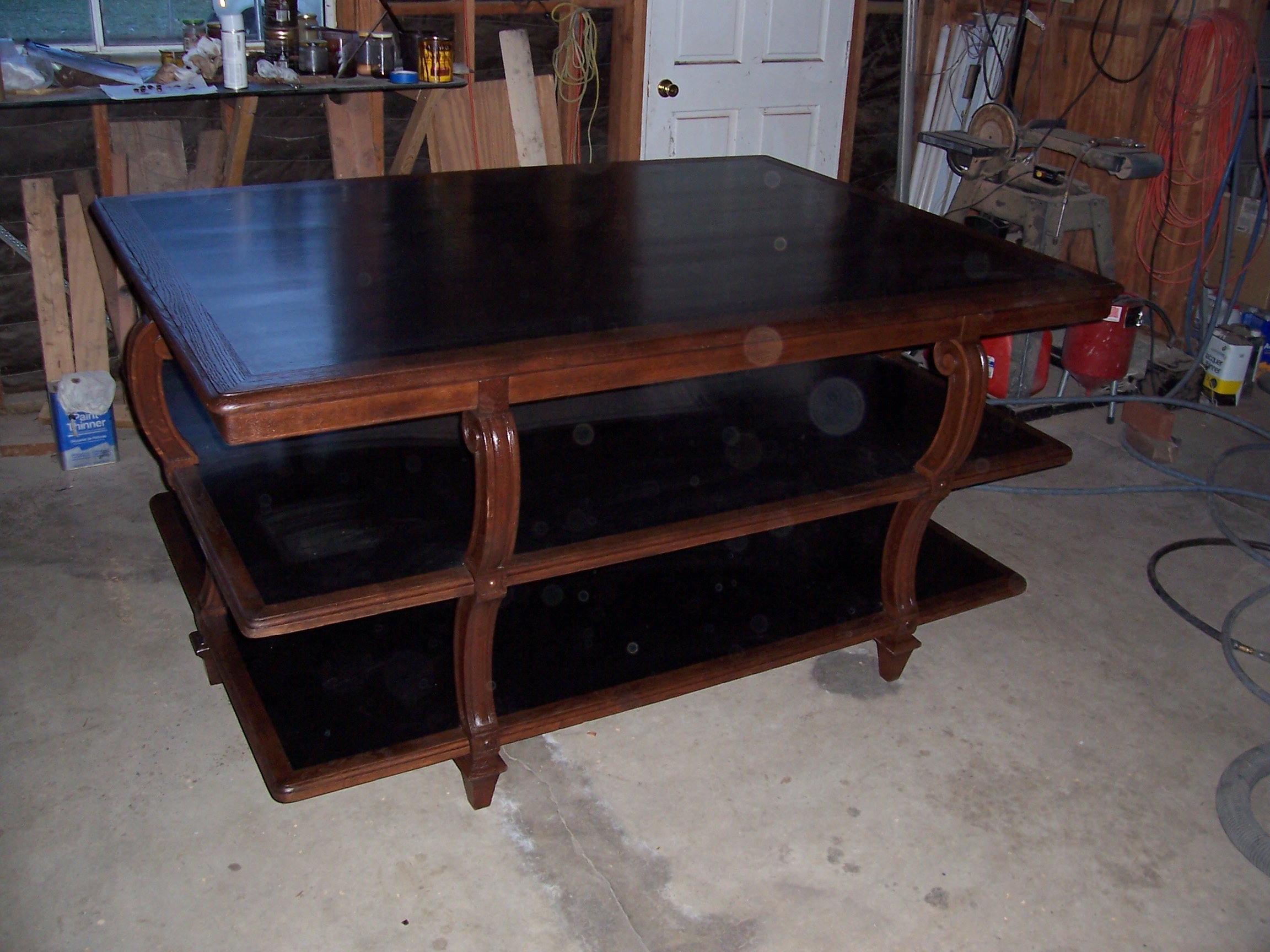 A garage table with shelves, organized and ready for tools and storage