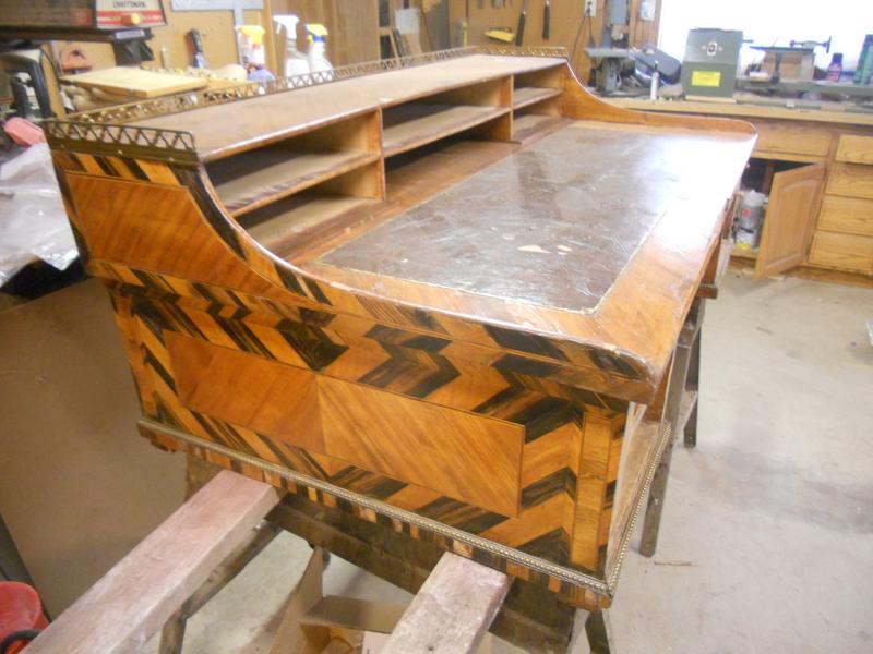 Old wooden desk featuring a black and white checkered pattern